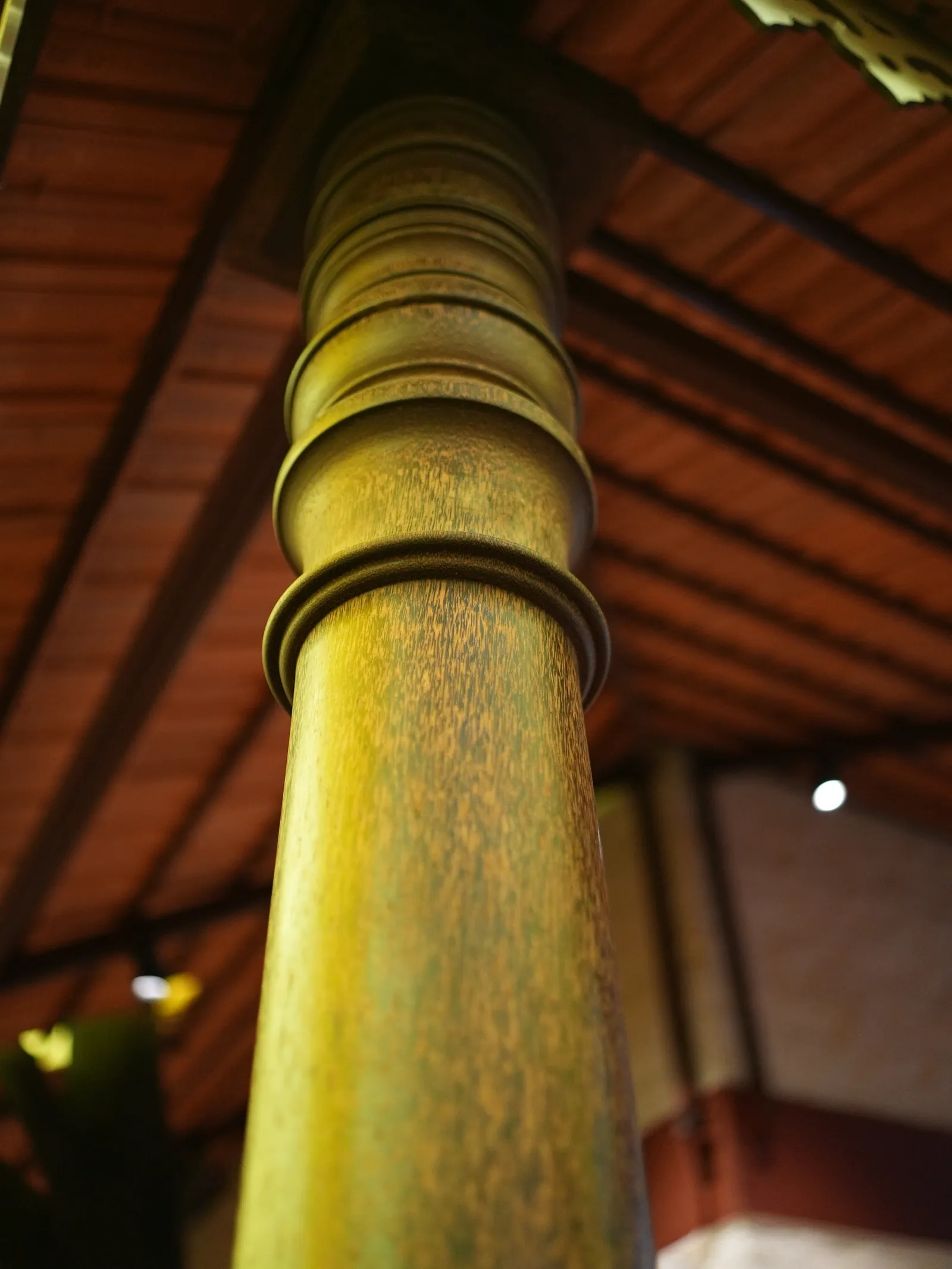 Green and gold-toned detail beneath the roof.