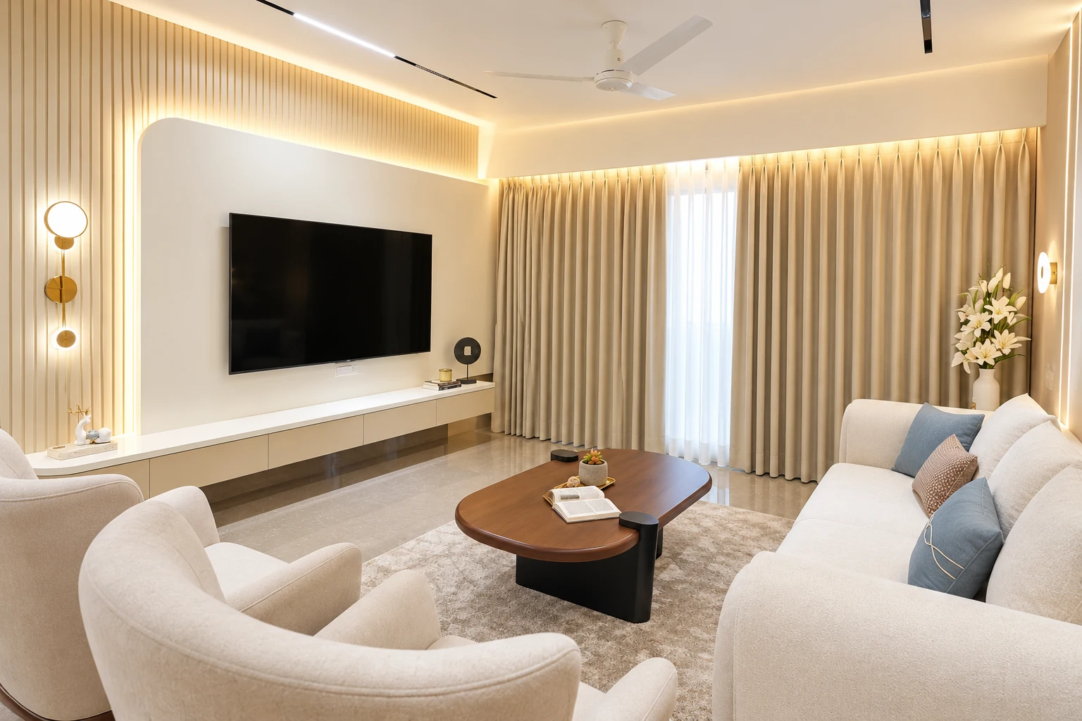 Living room with pale seating, a rounded coffee table and warm concealed lighting.